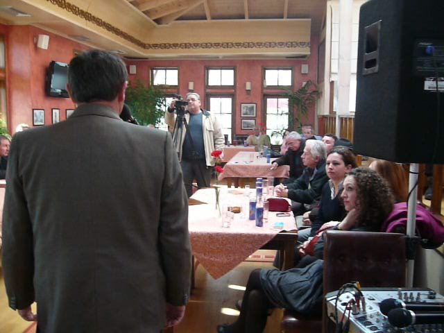 Addressing the audience at a literary event