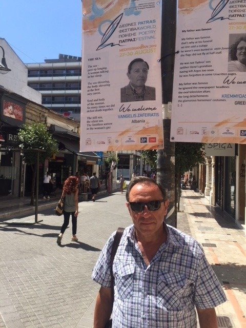 Beneath the welcome banner at the Patras World Poetry Festival
