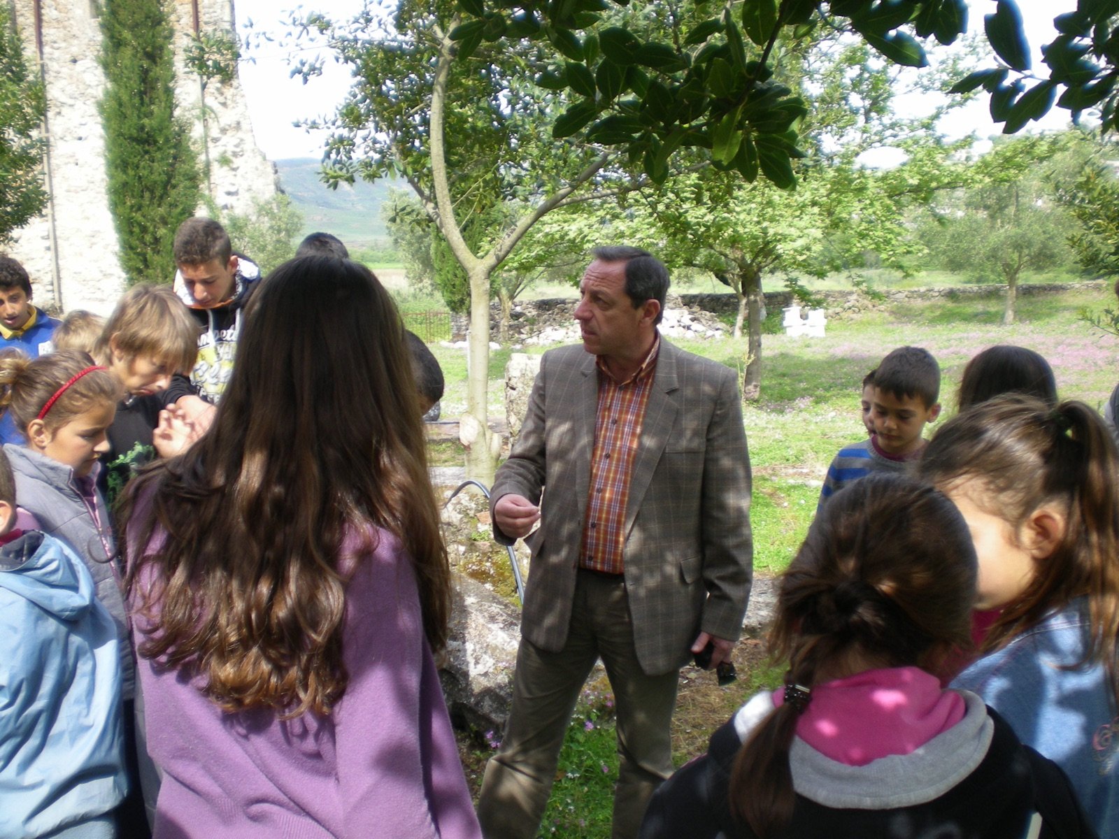 With pupils on a visit to an archaeological site